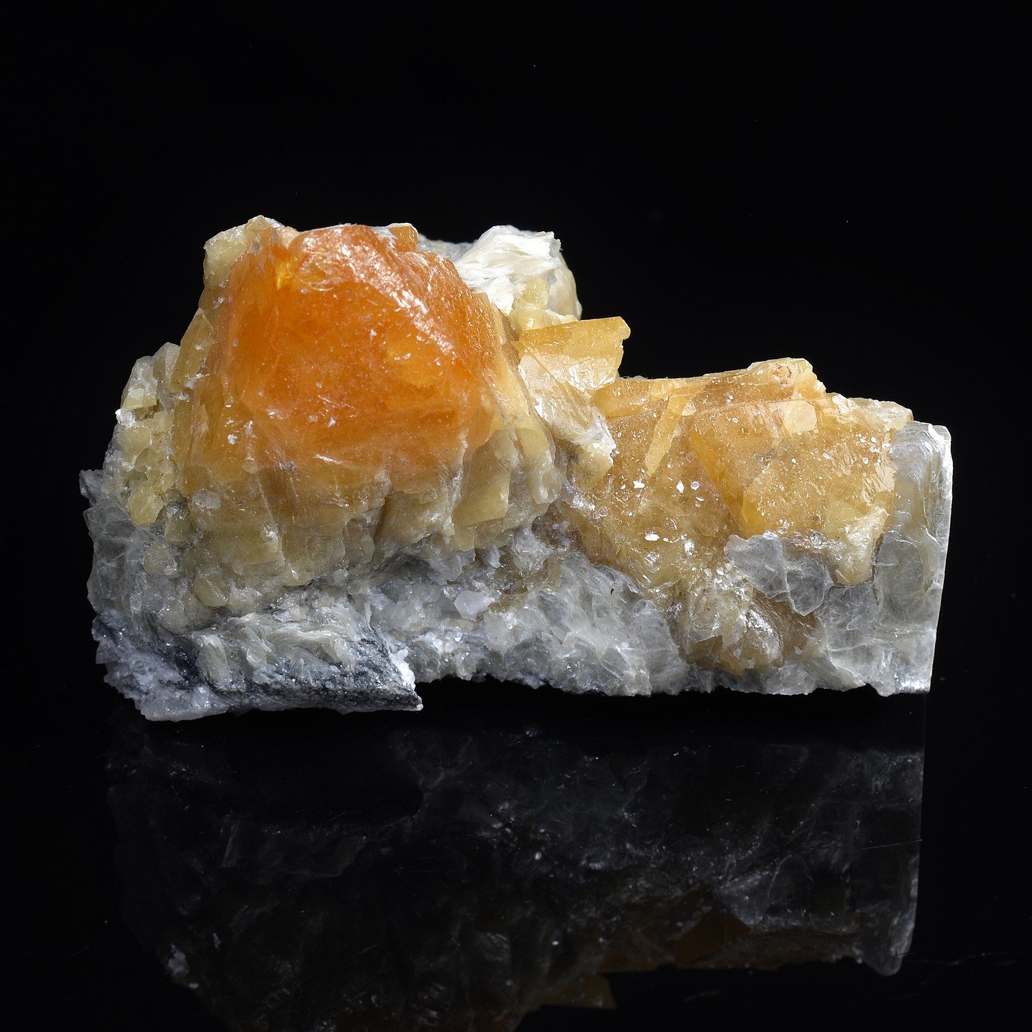 Scheelite on muscovite – Xuebaoding Mountains, Pingwu, Sichuan Province, China Scheelite on muscovite – Xuebaoding Mountains, Pingwu, Sichuan Province, China