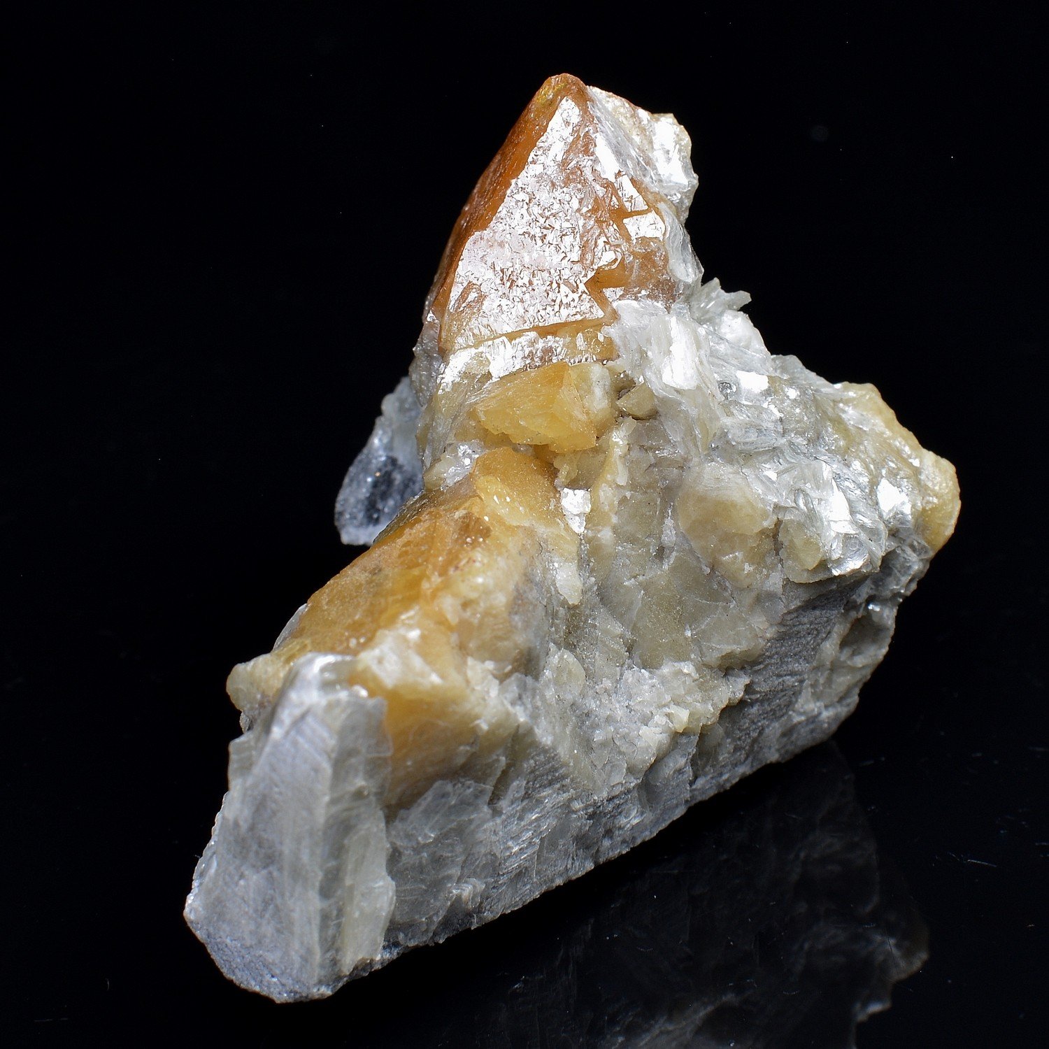 Scheelite on muscovite – Xuebaoding Mountains, Pingwu, Sichuan Province, China Scheelite on muscovite – Xuebaoding Mountains, Pingwu, Sichuan Province, China