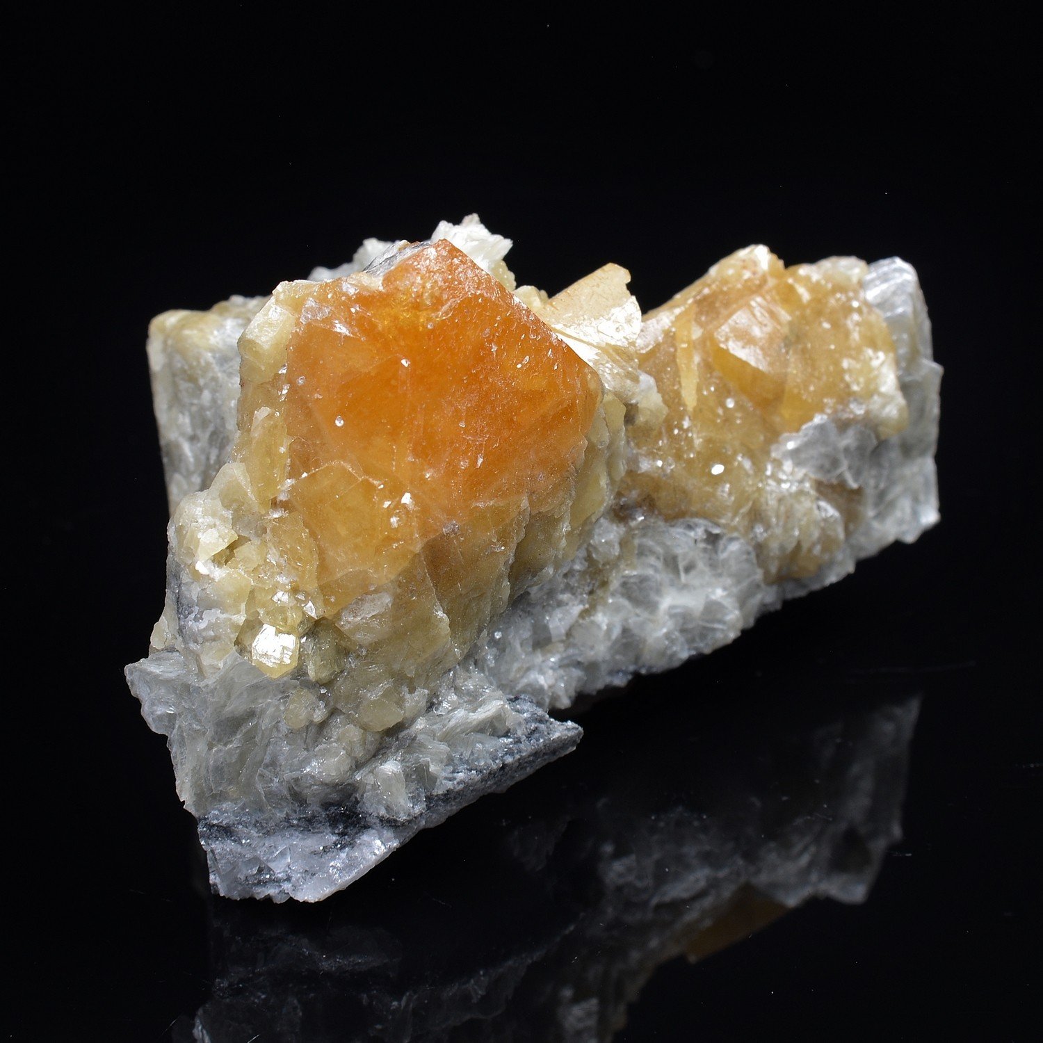 Scheelite on muscovite – Xuebaoding Mountains, Pingwu, Sichuan Province, China Scheelite on muscovite – Xuebaoding Mountains, Pingwu, Sichuan Province, China